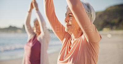 Women friends, beach yoga and smile in morning with stretching legs for  health, wellness and training. Black woman, exercise group and motivation  for teamwork with balance, peace and support by sea