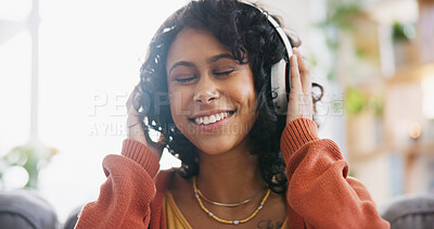 Home, dance and woman with headphones, music and motivation with audio, streaming radio and listen. Person on a couch, girl and lady with headset, energy and song with freedom, wellness and happiness