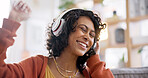 Home, smile and woman with headphones, music and dance with audio, streaming sounds and songs. Person on a couch, girl and lady with headset, energy and radio with freedom, motivation and happiness