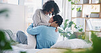 Hug, home bed and couple kiss with love, care and support in a bedroom with relax and bonding. Embrace, happy young people and smile in a house with a woman and man together with romance in morning