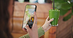 Phone screen, photography and green juice for diet, woman or glass in cafe for social network app. Influencer girl, smartphone and smoothie in post, update and web blog for nutrition, detox or health