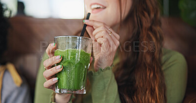 Smoothie, drink and hands of woman in restaurant with healthy, green tea or cocktail of juice with fruits and vegetables. Drinking, matcha or girl in vegan coffee shop with liquid fruit or nutrition