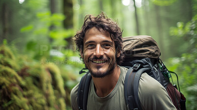 Portrait of a man or male hiking in a forest. Happy, smiling and looking. Cheerful forest hiker