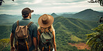 Couple standing in the middle of a forest admiring the beautiful nature view. Explore and travel