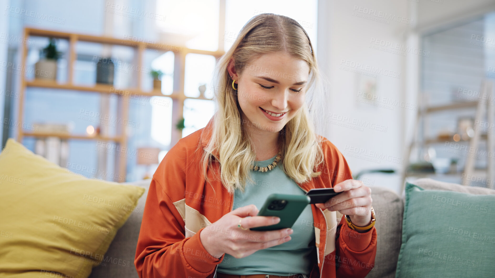 Buy stock photo Woman, credit card and phone for online shopping in home with digital payment, fintech and finance of money. Happy person on sofa for mobile banking, ecommerce and password for sales on financial app