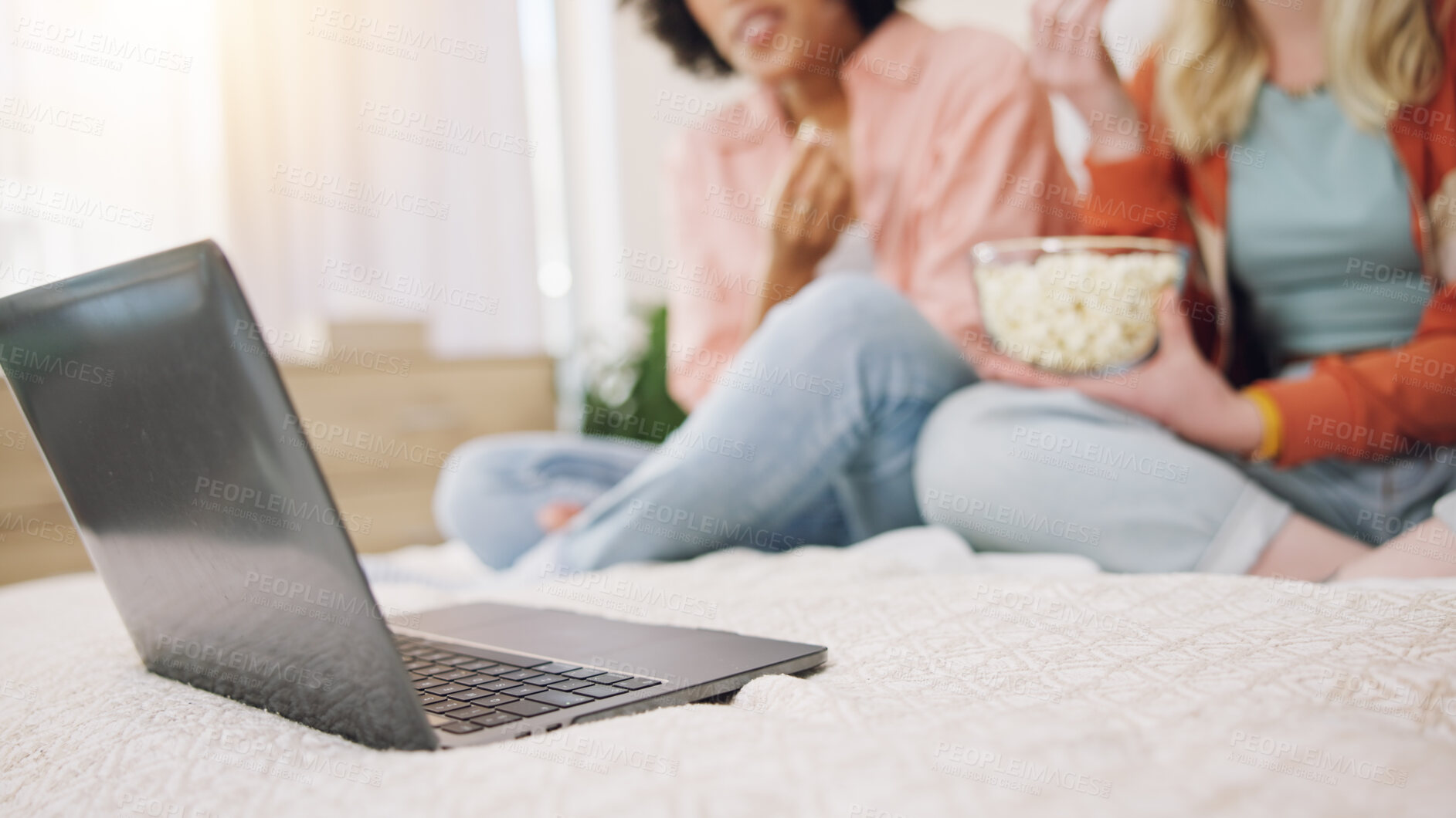 Buy stock photo Laptop, movie and women friends on a bed with popcorn for comedy, program or film in their home. Online, video and ladies in a bedroom with snack for streaming, comic or stand up, show or documentary