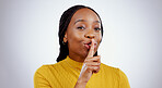 Secret, woman and portrait with finger on lips in studio for sign of privacy, confidential deal and surprise on white background. Face of african model show quiet emoji for gossip, news and whisper 