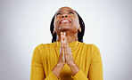 Hands, praying and nervous black woman with wish in studio with sign of anxiety, faith or good luck in white background. Please, emoji and person with prayer, blessing or anxiety waiting for results