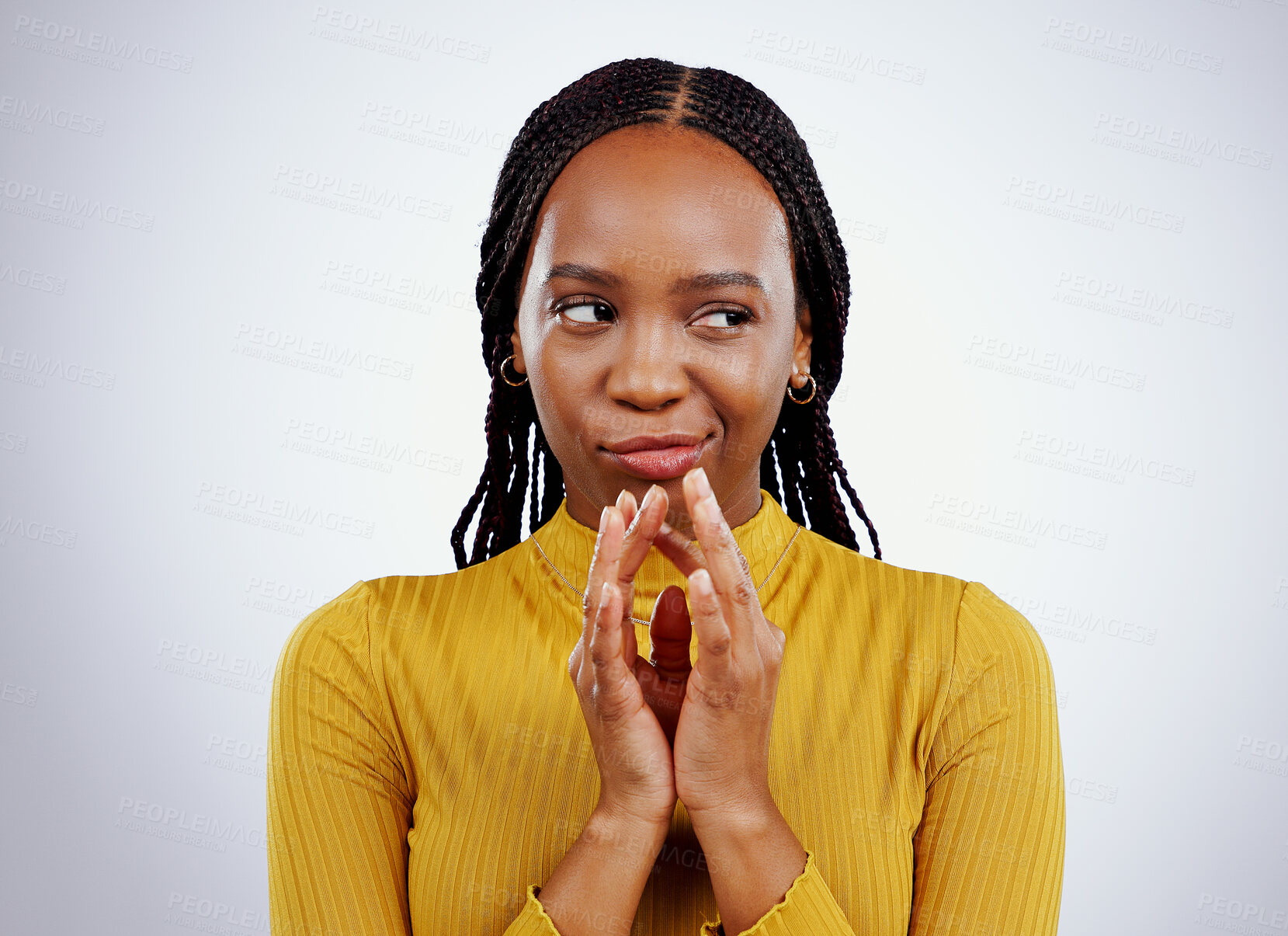 Buy stock photo Thinking, smirk and black woman with scheme hands in studio for evil, planning or revenge on grey background. Plotting, villain and African female model with steeple emoji for brainstorming idea