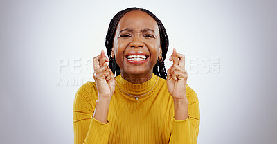 Buy stock photo Fingers crossed, praying and black woman in studio with sign of good luck for bonus, prize or lottery in white background. Hope, wish and nervous person with hands, emoji and waiting for results