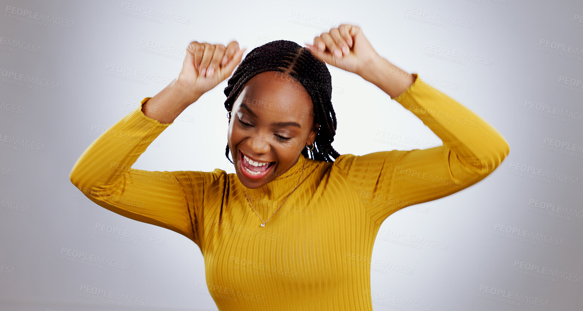 Buy stock photo Dance, celebration and happy black woman in studio with freedom, feel good or music on grey background. Energy, moving and excited African female model with rhythm for radio, news or deal success