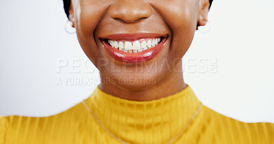 Buy stock photo Teeth whitening, smile and black woman with mouth closeup for beauty or dental happiness in studio white background. African, lips and wellness from dentist, healthcare and veneers or orthodontics 