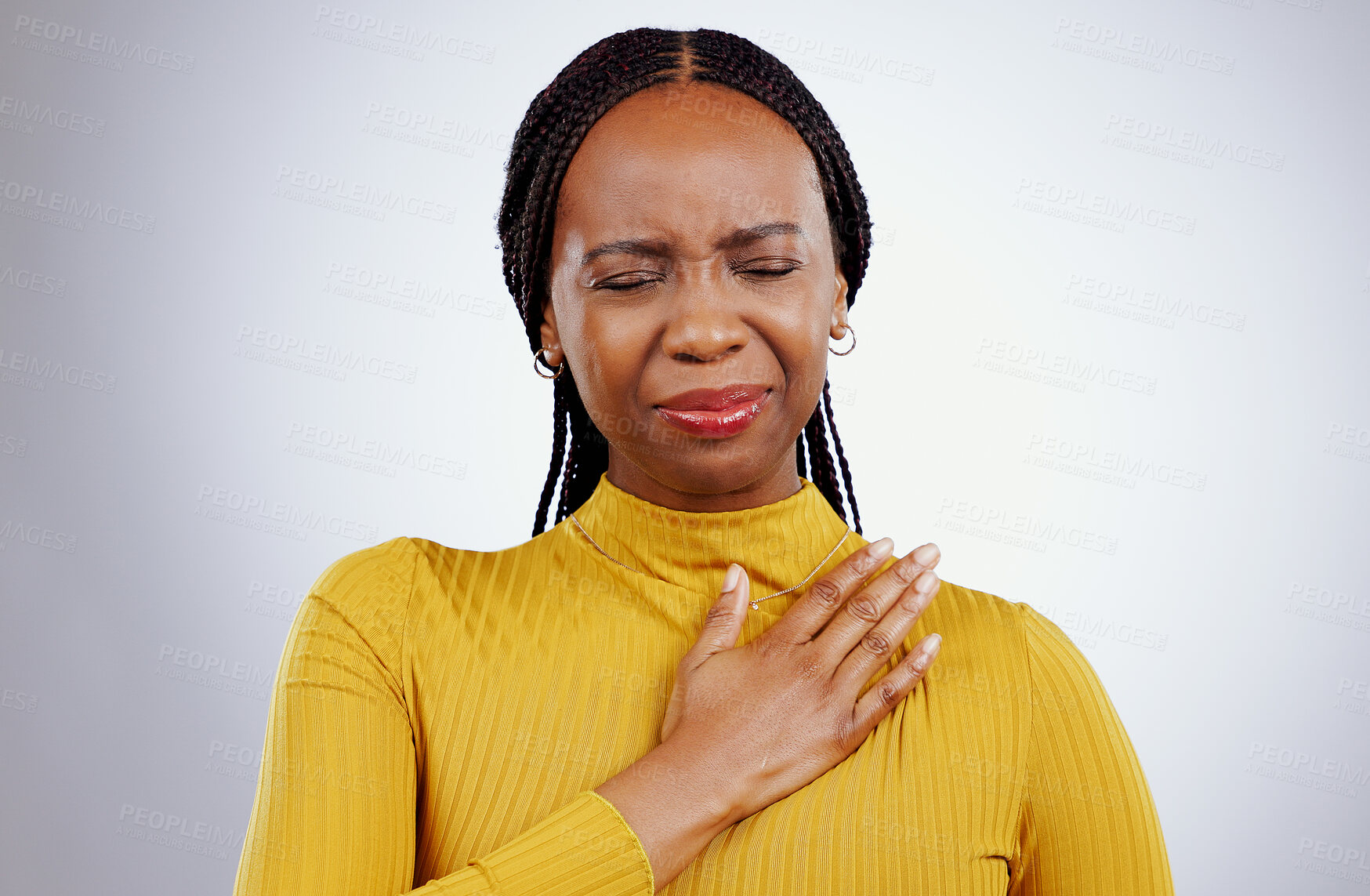 Buy stock photo Heart pain, black woman and ache with stress, anxiety and problem from cardiology crisis in studio. White background, African female person and heartburn with cardiac arrest and sick from grief