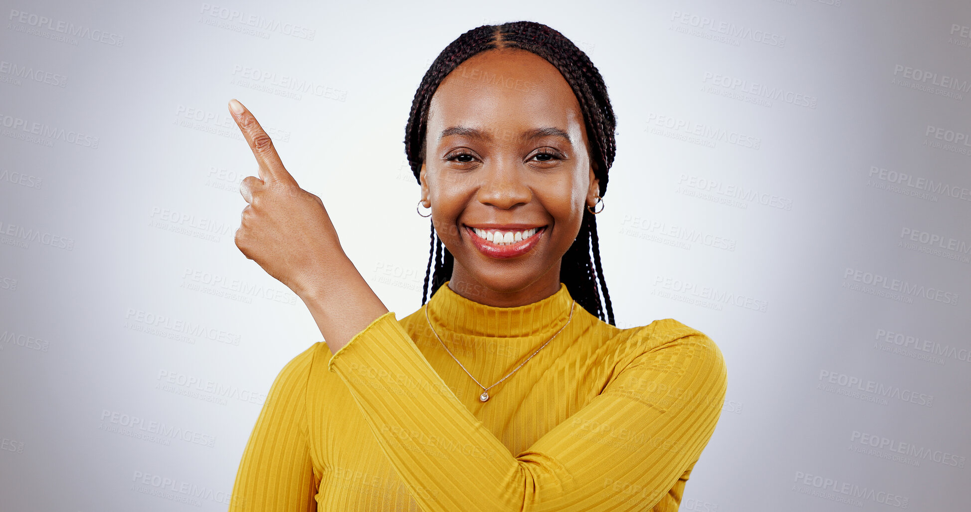 Buy stock photo Black woman, portrait and pointing in studio for advertising information, deal or choice on white background. Happy model, presentation or mockup space for feedback, promotion or announcement of news