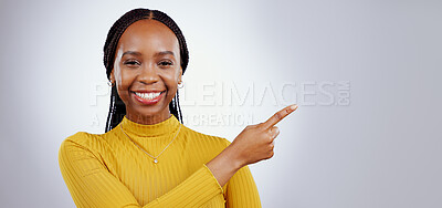 Buy stock photo Portrait, smile and black woman with hand pointing in studio for presentation, checklist or promo on grey background. Timeline, schedule and face of female model show faq, menu or step, guide or info