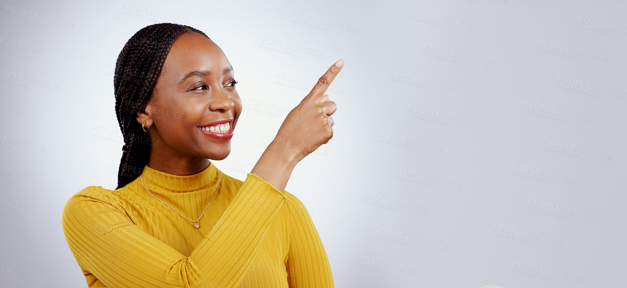 Buy stock photo Woman, pointing and in studio announcement for discount, promotion and happy for opportunity or marketing deal. Black person, model or smile for sales choice in retail, wow news or gray background