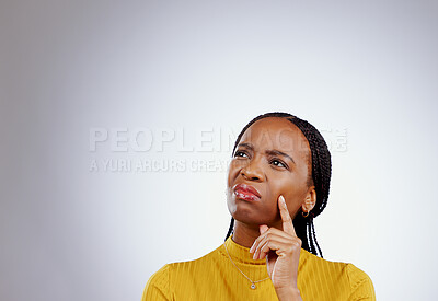 Buy stock photo Thinking, idea and black woman in a studio with memory, brainstorming and planning facial expression. Guess, question and young African female model with a confused face isolated by gray background.