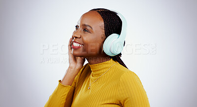 Buy stock photo Woman, headphones and listening to music or smile, audio and song in studio by gray background. Black female model, hearing and streaming radio, sound and playlist for peace, chilling and mockup