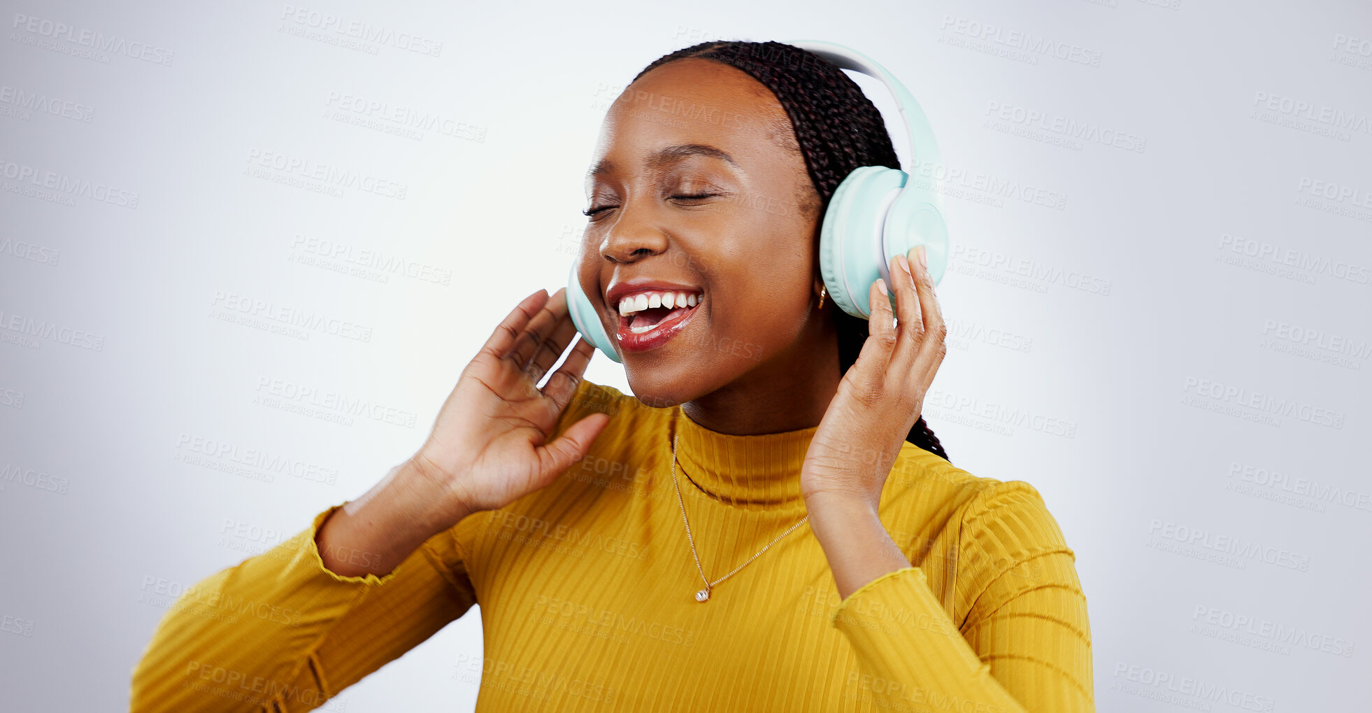 Buy stock photo Woman, headphones and listening to music or dance, audio and song in studio by gray background. Black female model, hearing and streaming radio, sound and playlist for peace, chilling and mockup