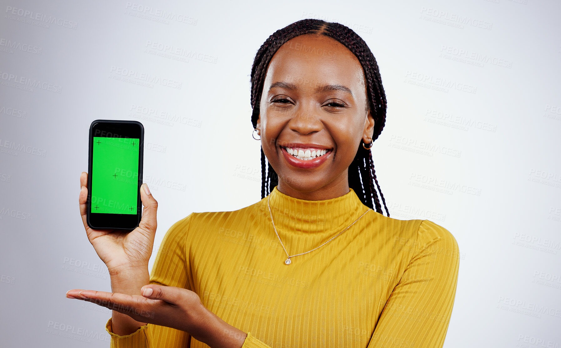 Buy stock photo Woman, phone and green screen of marketing mockup, presentation and happy news on a white background. Face of african person on mobile app, design space and opportunity with tracking marker in studio