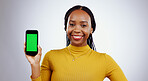 Happy woman, phone and green screen of marketing mockup, presentation and happy news on white background. Portrait of african person on mobile app, website design space and tracking markers in studio