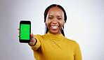 Woman, student and phone green screen for marketing mockup, e learning sign up or news on white background. Portrait of african person on mobile app space, college contact or education FAQ in studio