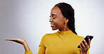 Hand, choice and black woman with phone for social media, advertising and promotion in white background. Show, mockup or gesture to space for communication, information or product placement in studio