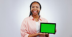 Woman, student and tablet green screen for e learning, online education or college website on white background. Portrait of african person on digital technology or space for study software in studio