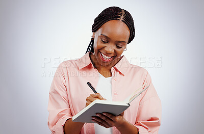 Buy stock photo Happy woman, notebook and writing ideas, planning or creative solution for studying, college or education goals in studio. African student with book reminder or notes for learning on white background