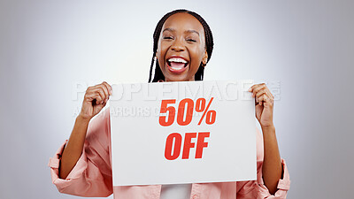 Portrait, sale sign or happy black woman by discount deal, 50 percent off offer or launch ad. Excited, smile or person with board for message, marketing or promotion card on grey background in studio