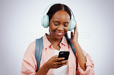 Woman, student and headphones on mobile for music, elearning audio and education on a white background. Happy african person in backpack and electronics for listening or streaming on phone in studio