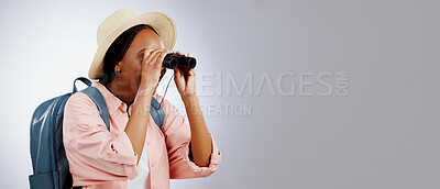Woman, binoculars and explore on adventure, studio and travel or backpack by gray background. Black person, vacation and holiday in mockup, watch and search on journey, gear and equipment for tourist