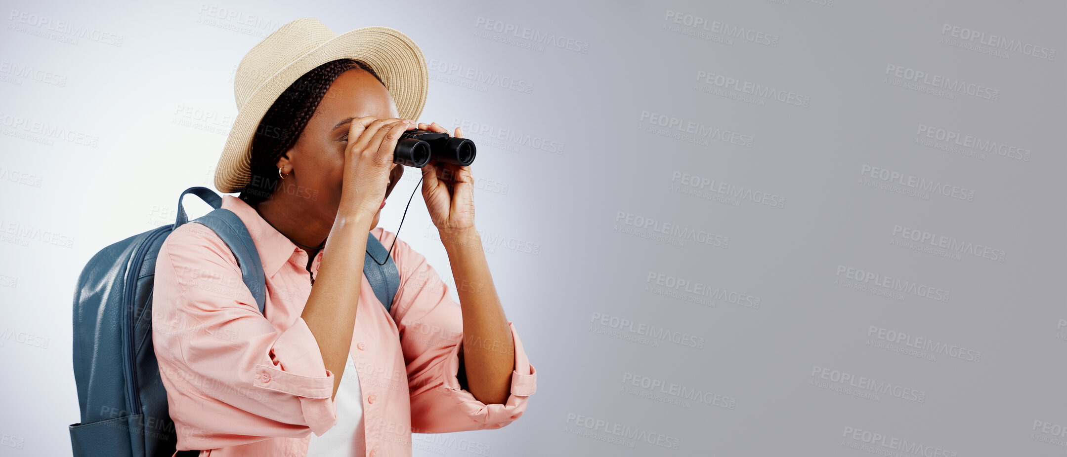 Buy stock photo Woman, binoculars and explore on adventure, studio and travel or backpack by gray background. Black person, vacation and holiday in mockup, watch and search on journey, gear and equipment for tourist