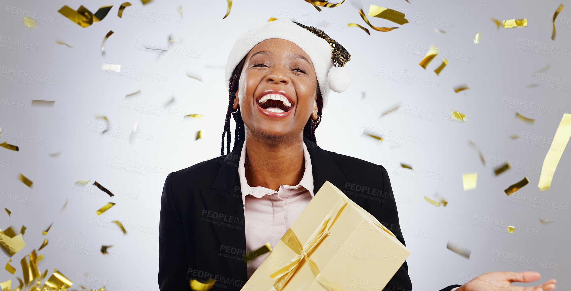 Buy stock photo Portrait, confetti and business with black woman, present and celebration on a white studio background. Face, African person and employee with a gift, winning and hat with giveaway and achievement