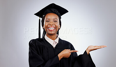 Buy stock photo Graduate, black woman and portrait with pointing to college deal and academy promotion in studio. Happy, university student and school marketing with white background and African person with study