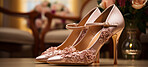 Wedding fashion, high heels and shoes for woman. Bridal stiletto on table. Close-up, cosmetic and beautiful on background.