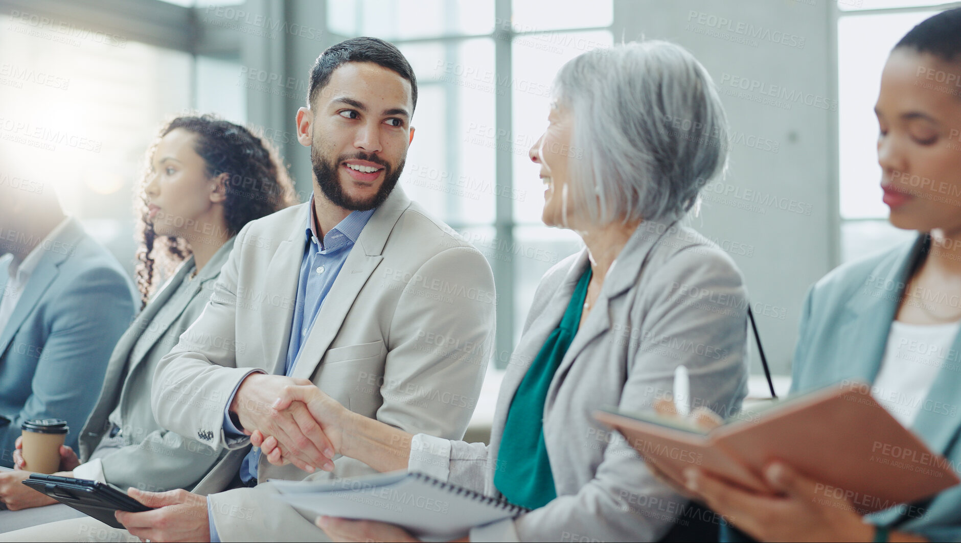 Buy stock photo Happy business people, handshake and meeting in seminar greeting, introduction or teamwork at office. Businessman shaking hands with woman in staff training, team workshop or recruiting at workplace