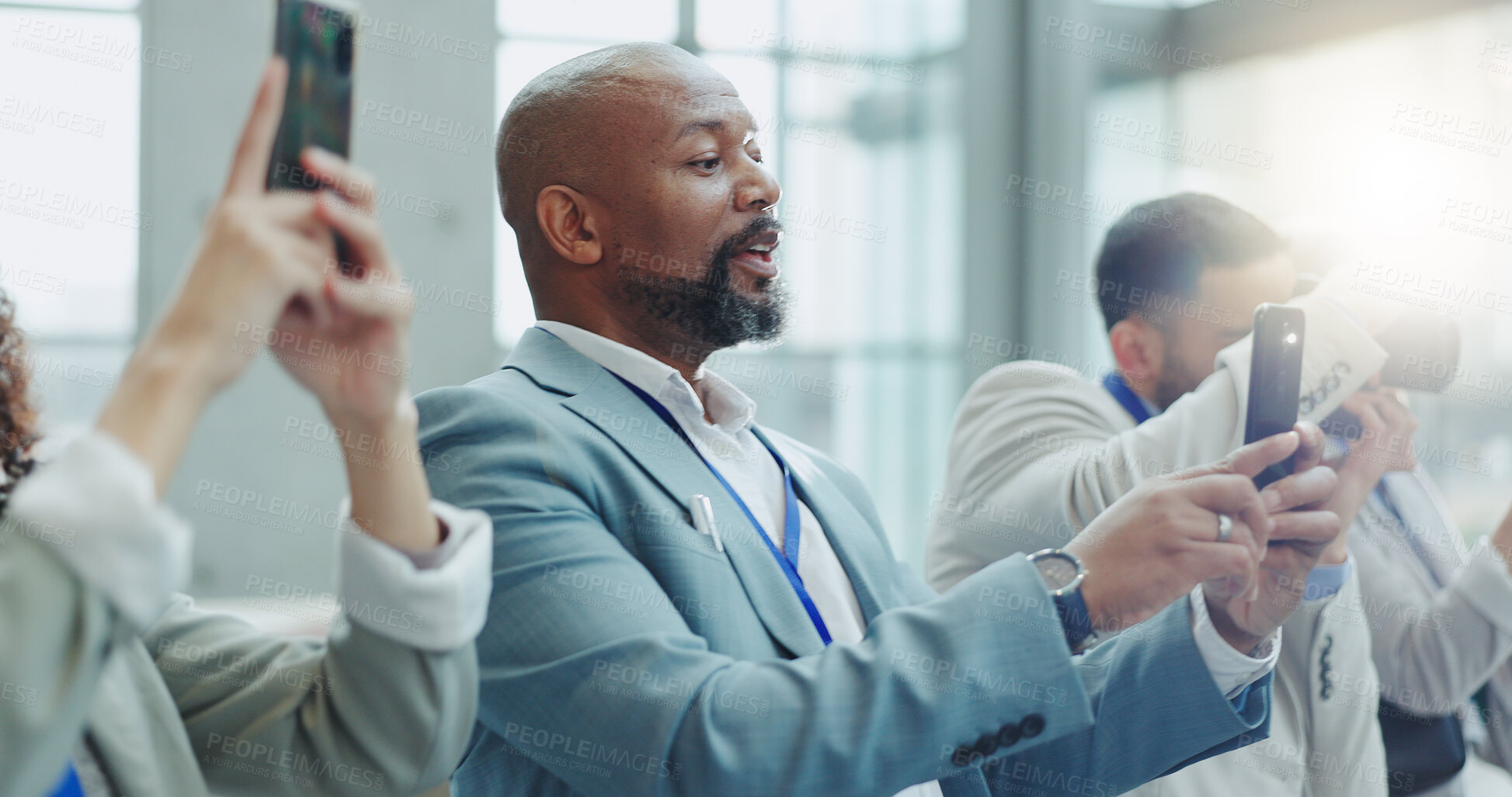 Buy stock photo Business people, press and phone at a workshop with journalist and media staff with live streaming. Tradeshow, seminar and employee filming with mobile and reporter at a job working on a event