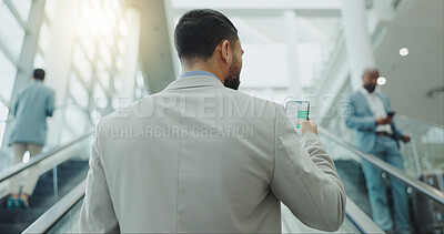 Buy stock photo Businessman, phone and travel on escalator at airport for online booking, flight time or boarding. Rear view of man checking plane schedule on mobile smartphone for business trip on moving staircase