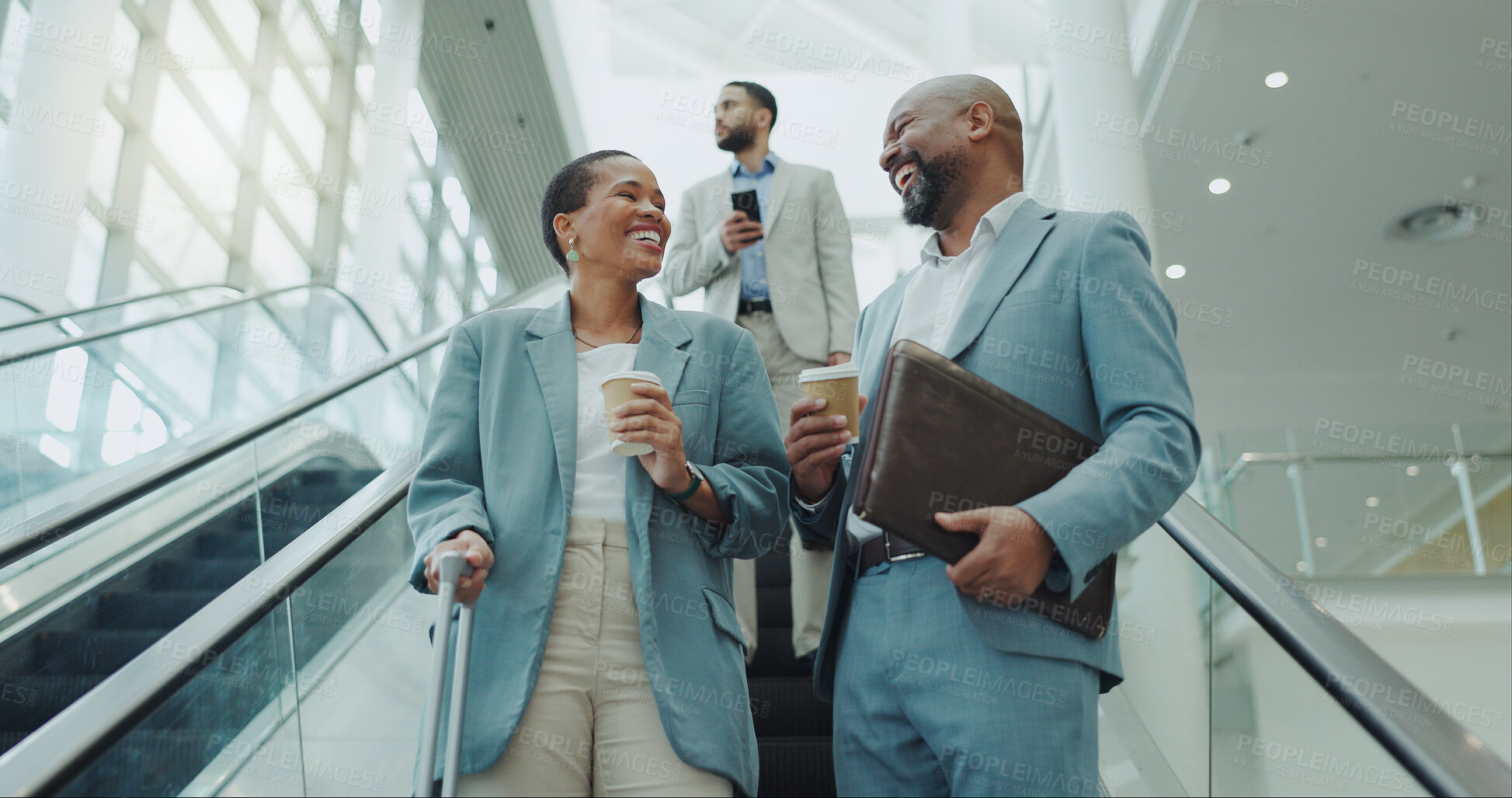 Buy stock photo Happy business people, coffee and laughing on escalator for funny joke, discussion or morning at airport. Businessman and woman smile with latte or cappuccino down a moving staircase for work travel