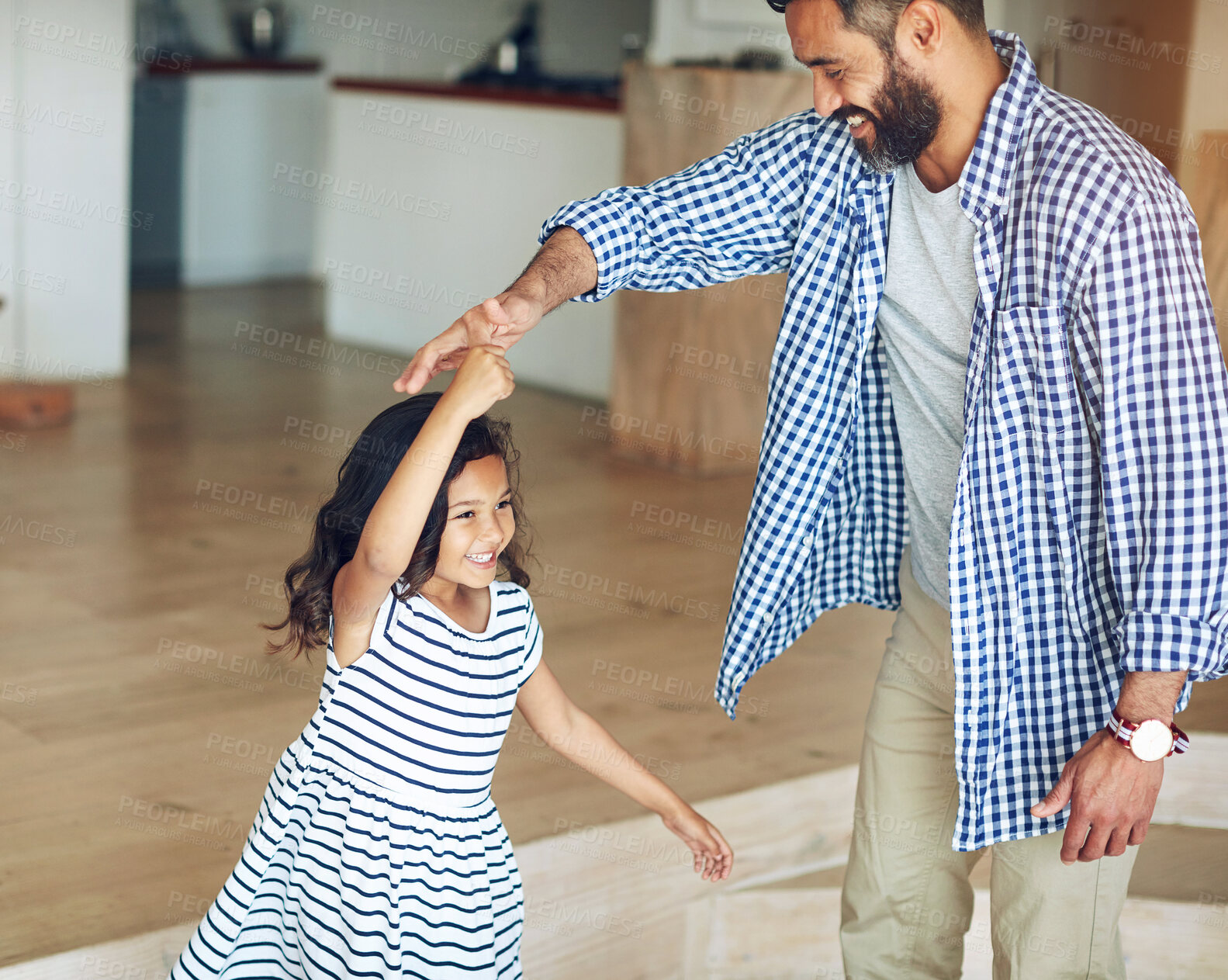 Buy stock photo Family, father and girl dance, home and happiness with love, bonding and movement in the lounge. Male parent, female child and daughter with dad, kid and dancing for fun, playful and loving together