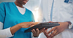 Doctor, hands and tablet in teamwork, research or healthcare advice together at the hospital. Closeup of medical professional or nurse with technology in team planning, strategy or results at clinic