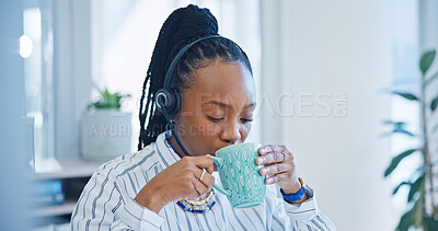Happy black woman, call center and drinking coffee in customer service, support or telemarketing at office. African female person, consultant or agent enjoying hot beverage in contact us at workplace