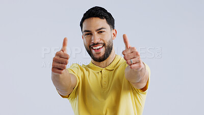 Buy stock photo Thumbs up, portrait and man in studio for winner, achievement and celebrate deal on white background. Happy indian model, emoji and like sign for yes feedback, promotion and thank you for excellence 