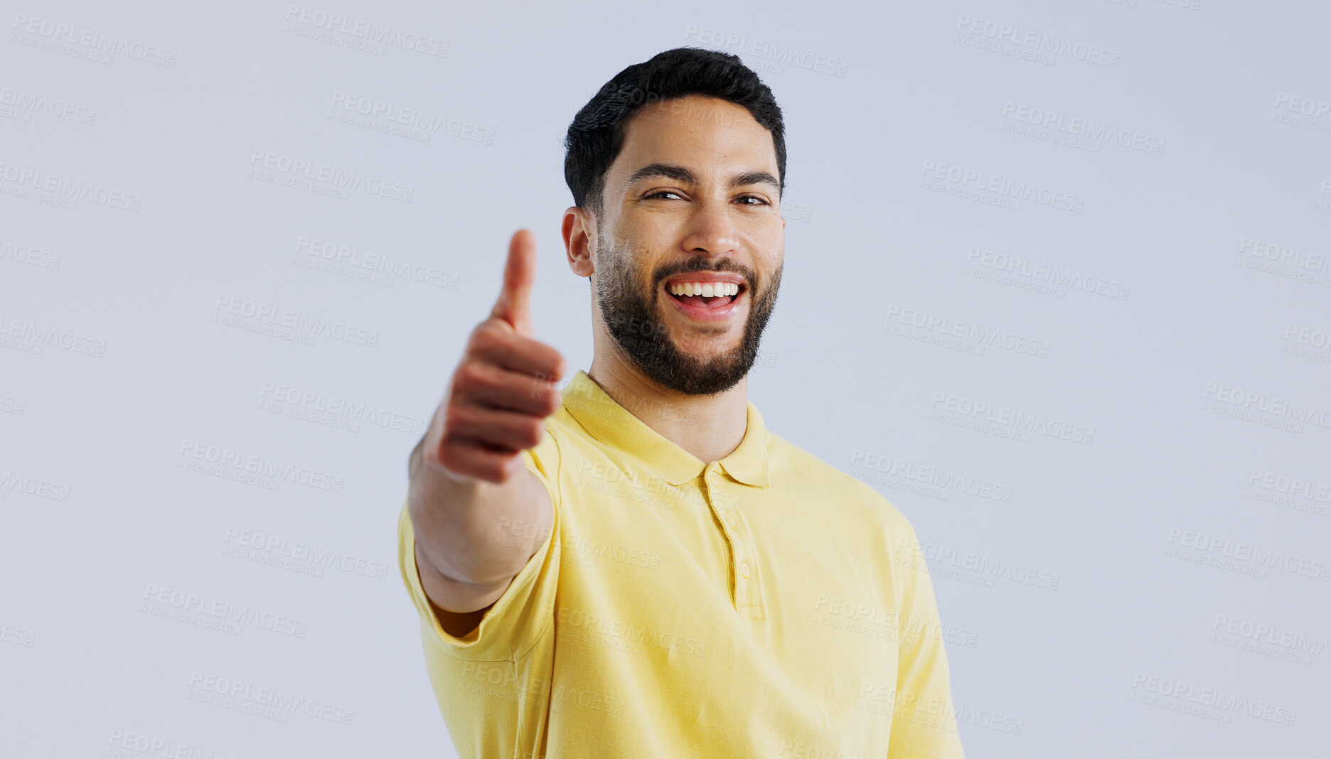 Buy stock photo Thumbs up, portrait and man in studio for agreement, winning achievement and celebrate deal on white background. Happy indian model, emoji and like sign for feedback, yes and thank you for excellence