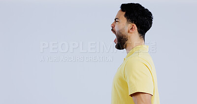 Buy stock photo Scream, angry and man in studio at mockup space for crisis, conflict and mad emoji reaction on white background. Profile of frustrated indian model shouting with stress, anger and negative expression