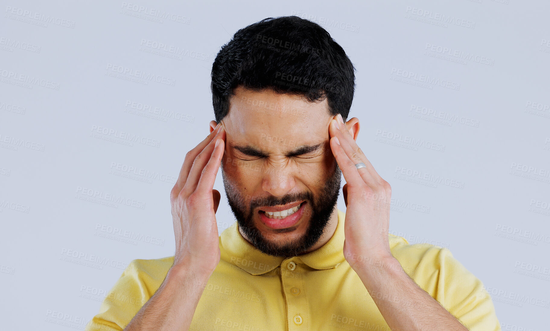 Buy stock photo Headache, sick and man in studio with stress, vertigo and mental health on white background. Face of frustrated indian model with pain, anxiety and tired of migraine, burnout and fatigue of brain fog