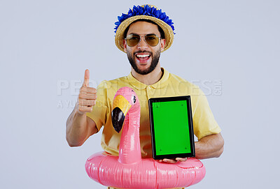 Buy stock photo Green screen, tablet and happy man with thumbs up in studio for travel, review or service feedback on grey background. Digital, space or male traveler smile with emoji vote for app, offer or approval