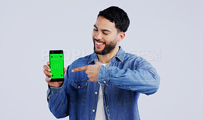 Buy stock photo Man, cellphone or pointing to green screen in portrait, mockup space or happy for advertising. Arab person, smile or face in marketing of tracking markers, mobile app or contact by white background