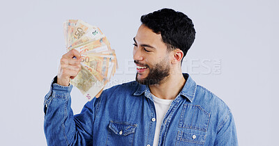 Buy stock photo Man, money fan and smile in studio with thinking for financial freedom, goals and decision with success by background. Person, ideas and winner with bonus cash, revenue or excited for salary increase